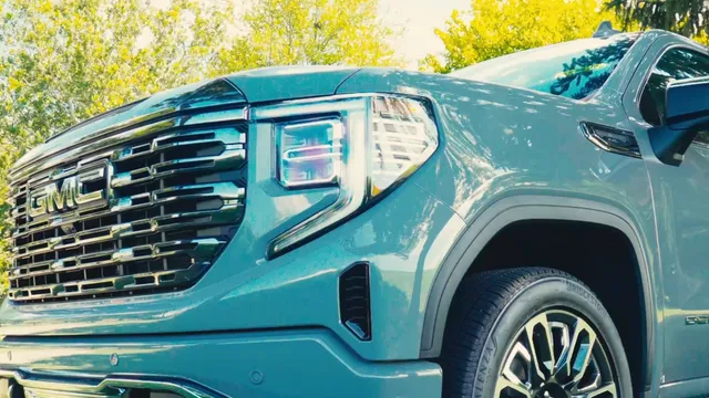 Front three-quarter view of a GMC Sierra Denali Ultimate parked on grass
